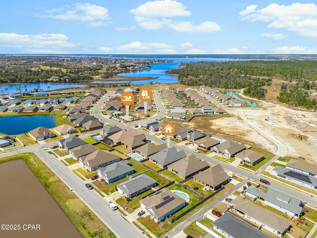 bird's eye view featuring a residential view and a water view