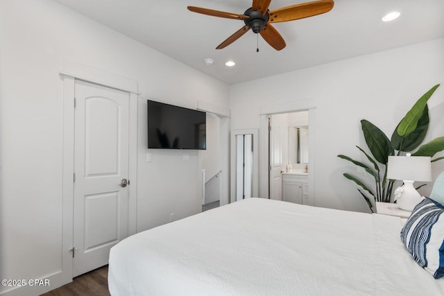 bedroom featuring recessed lighting, connected bathroom, ceiling fan, and dark wood-style flooring