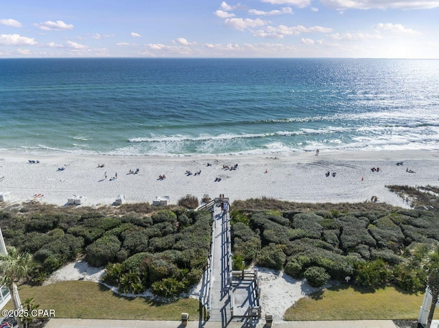 birds eye view of property featuring a water view and a view of the beach