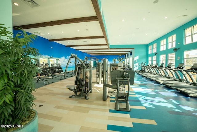 workout area featuring visible vents and carpet flooring