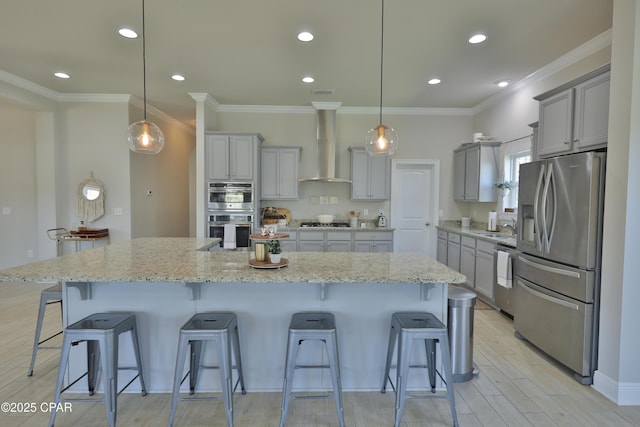 146 Bayou Manor Rd, Santa Rosa Beach, FL 32459 - kitchen featuring gray cabinets, a sink, wall chimney exhaust hood, a breakfast bar, and stainless steel appliances