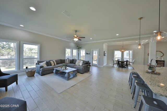 146 Bayou Manor Rd, Santa Rosa Beach, FL 32459 - living area featuring crown molding, light wood-type flooring, recessed lighting, visible vents, and ceiling fan