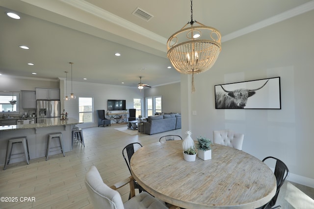146 Bayou Manor Rd, Santa Rosa Beach, FL 32459 - dining space with recessed lighting, visible vents, light wood-style floors, and crown molding