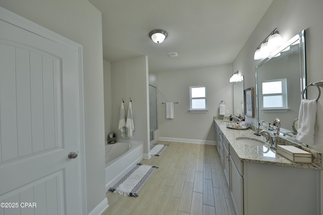 146 Bayou Manor Rd, Santa Rosa Beach, FL 32459 - bathroom featuring a bath, baseboards, wood finished floors, a sink, and a stall shower