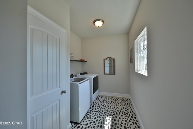 146 Bayou Manor Rd, Santa Rosa Beach, FL 32459 - clothes washing area with washer and clothes dryer, laundry area, and baseboards
