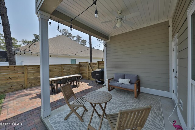 146 Bayou Manor Rd, Santa Rosa Beach, FL 32459 - view of patio / terrace with grilling area, fence, outdoor dining space, and ceiling fan