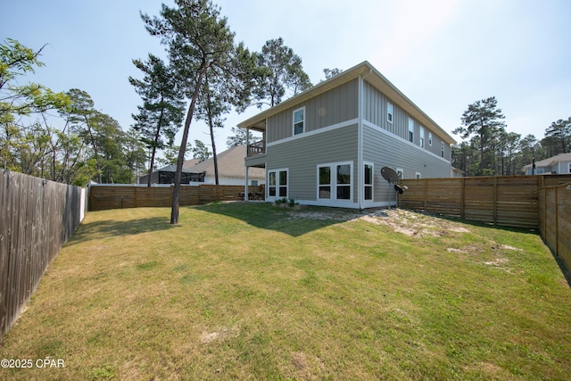 146 Bayou Manor Rd, Santa Rosa Beach, FL 32459 - rear view of house with a fenced backyard, board and batten siding, and a yard