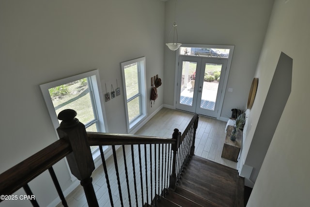 146 Bayou Manor Rd, Santa Rosa Beach, FL 32459 - entrance foyer featuring french doors, baseboards, a high ceiling, and wood finished floors