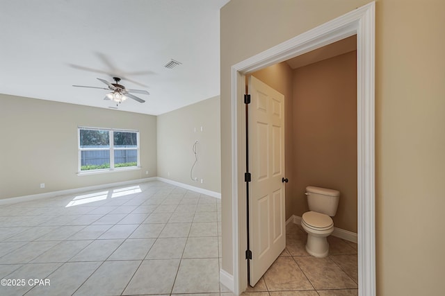 bathroom with visible vents, a ceiling fan, toilet, and tile patterned flooring