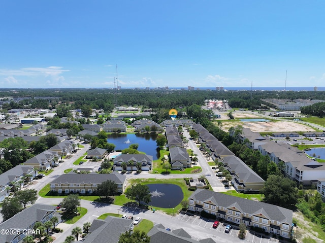 birds eye view of property featuring a water view and a residential view