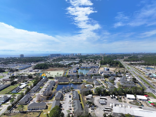 drone / aerial view featuring a view of city and a water view