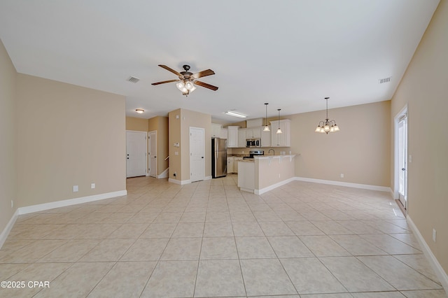 unfurnished living room featuring visible vents, baseboards, and ceiling fan with notable chandelier