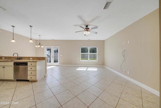 kitchen featuring light tile patterned flooring, visible vents, stainless steel dishwasher, open floor plan, and ceiling fan with notable chandelier