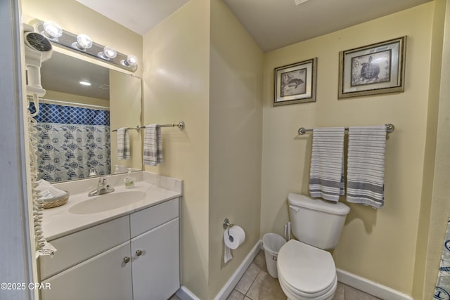 full bath with tile patterned flooring, toilet, vanity, and baseboards