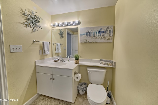 bathroom featuring baseboards, toilet, and vanity