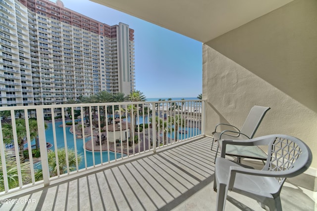 balcony featuring a water view