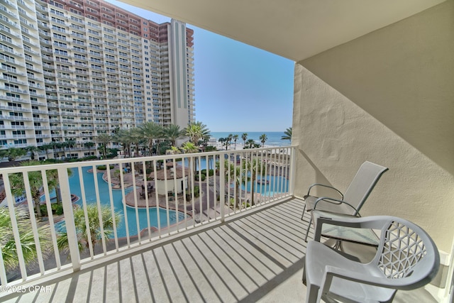 balcony featuring a water view