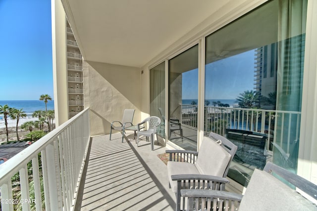 balcony featuring a water view