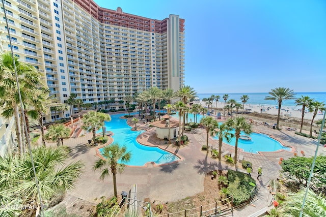 view of swimming pool with a water view