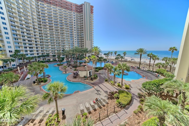 view of swimming pool featuring a water view