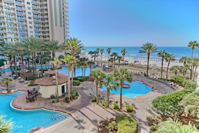 pool with a water view and a patio