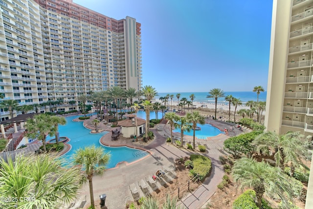 view of swimming pool with a water view