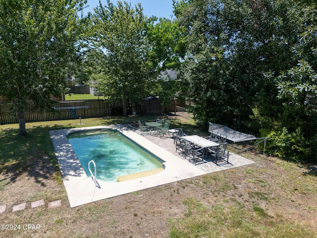 view of pool featuring a lawn, a patio area, a fenced backyard, and a fenced in pool