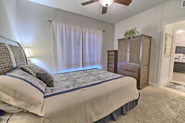 bedroom featuring carpet flooring, a ceiling fan, and visible vents