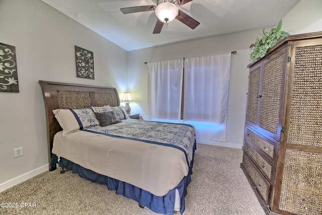 bedroom featuring baseboards, a ceiling fan, carpet flooring, and vaulted ceiling