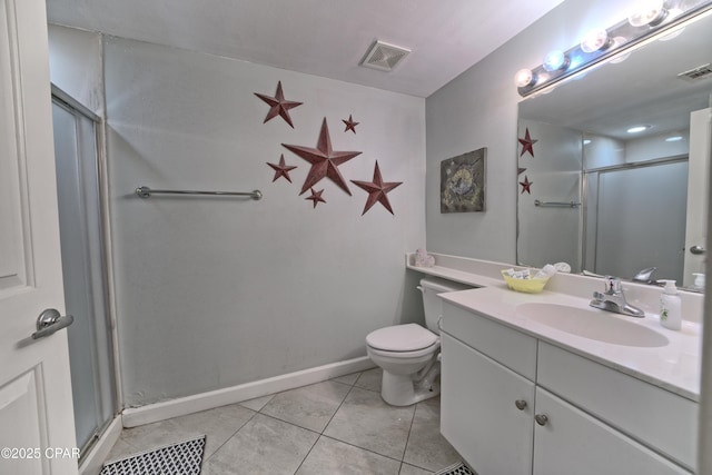 bathroom with vanity, visible vents, a stall shower, tile patterned flooring, and toilet