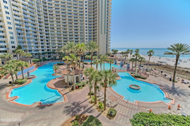 view of pool with a water view