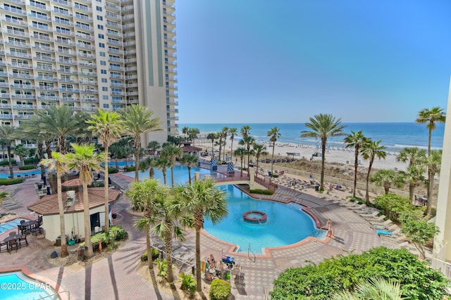 view of swimming pool with a water view