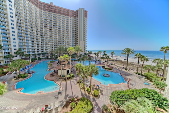 view of swimming pool featuring a water view