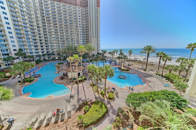 view of swimming pool featuring a water view