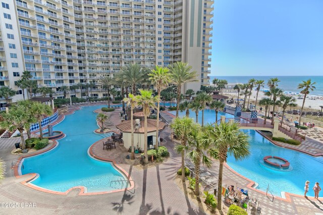 view of swimming pool with a water view