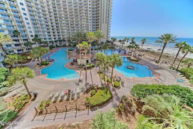 view of pool featuring a water view