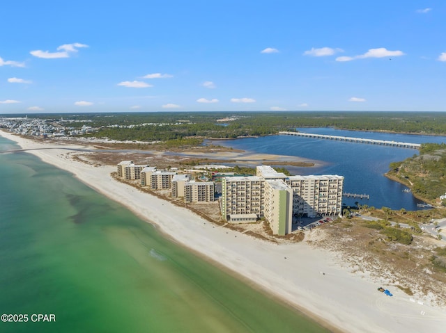 birds eye view of property featuring a view of the beach, a water view, and a view of city