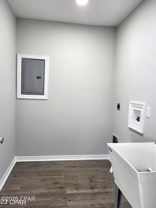 laundry area with baseboards, dark wood finished floors, washer hookup, laundry area, and hookup for an electric dryer