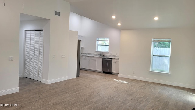 kitchen with visible vents, baseboards, dishwasher, light wood-type flooring, and white cabinetry