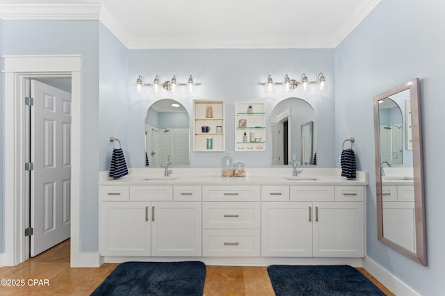 full bathroom featuring ornamental molding, a tile shower, and a sink