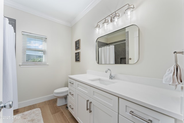 full bath featuring wood finished floors, ornamental molding, toilet, vanity, and baseboards