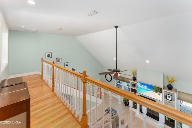 hallway featuring visible vents, recessed lighting, an upstairs landing, and baseboards