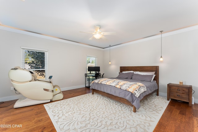 bedroom with baseboards, ornamental molding, ceiling fan, and wood finished floors