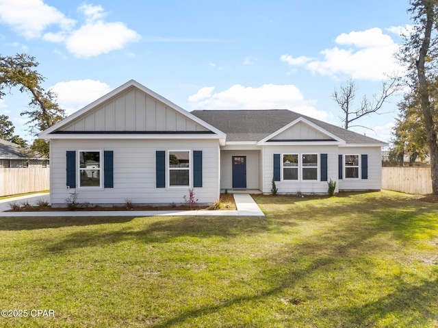 single story home featuring a shingled roof, board and batten siding, fence, and a front lawn