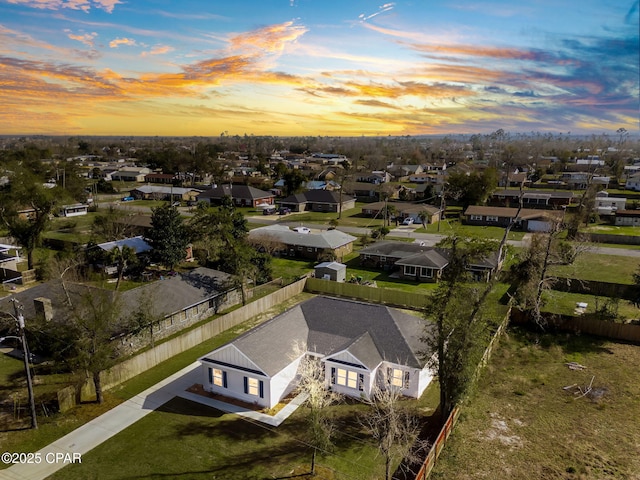 birds eye view of property with a residential view