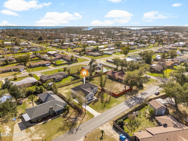 birds eye view of property with a residential view