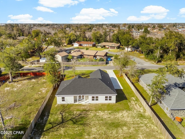birds eye view of property with a residential view