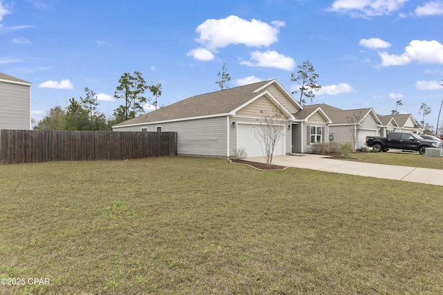 exterior space with a lawn, concrete driveway, an attached garage, and fence