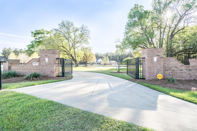 view of gate featuring fence