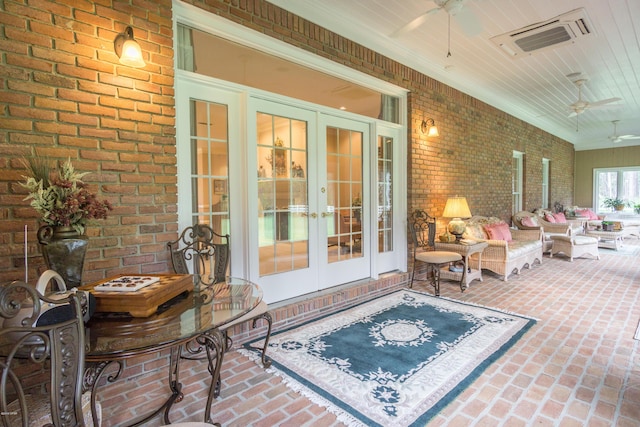 view of patio / terrace with a ceiling fan, french doors, and visible vents